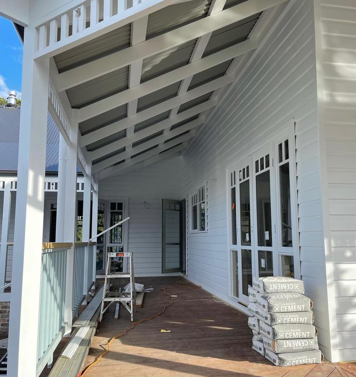 Best Paint for House Exteriors in Wollongong: A Local Painter's Guide 1 Freshly painted white weatherboard home exterior with crisp trim in Wollongong, finished by Colourland Painting