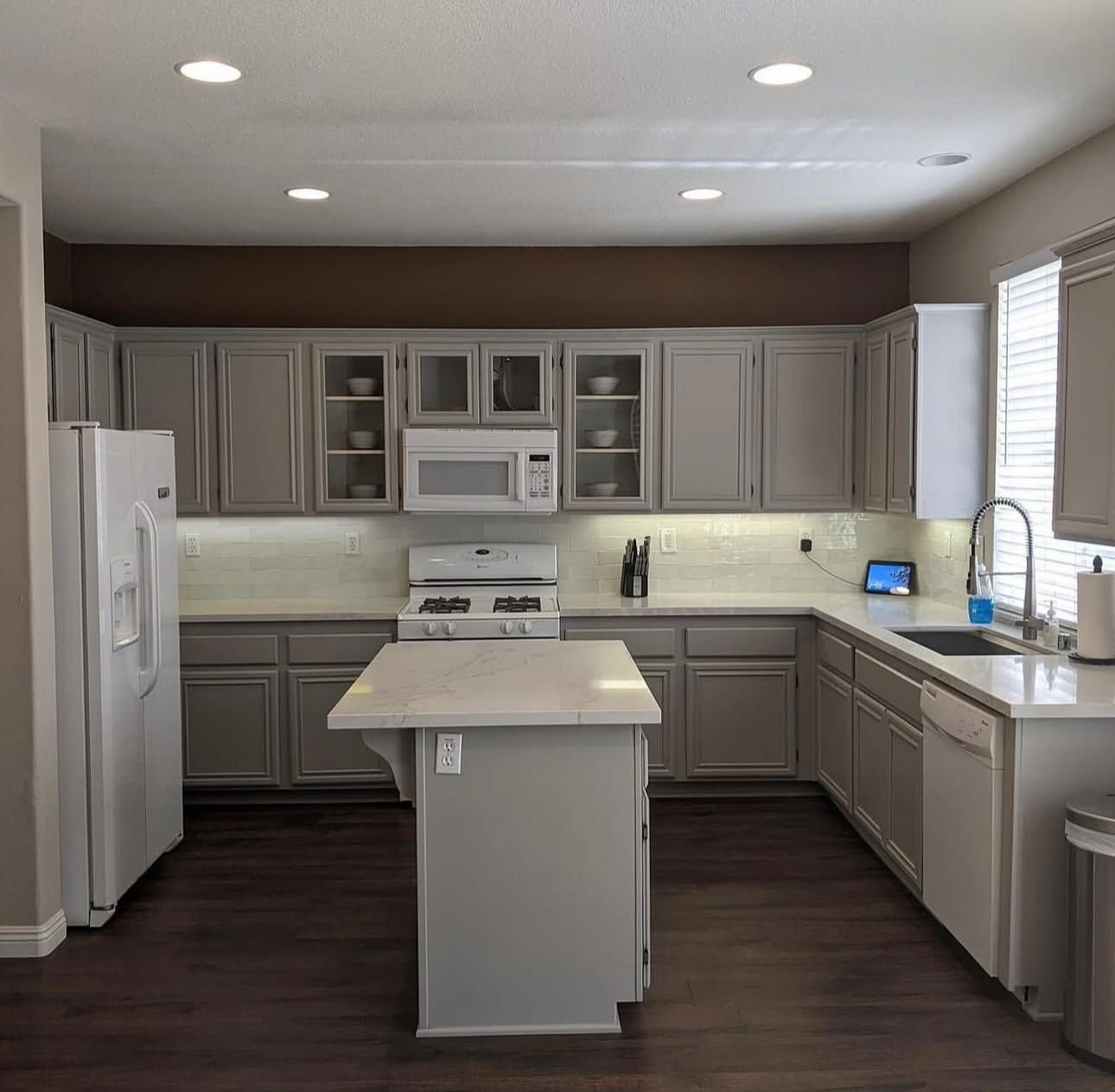 Wollongong kitchen cabinet painting transformation: cabinets repainted in a light grey finish
