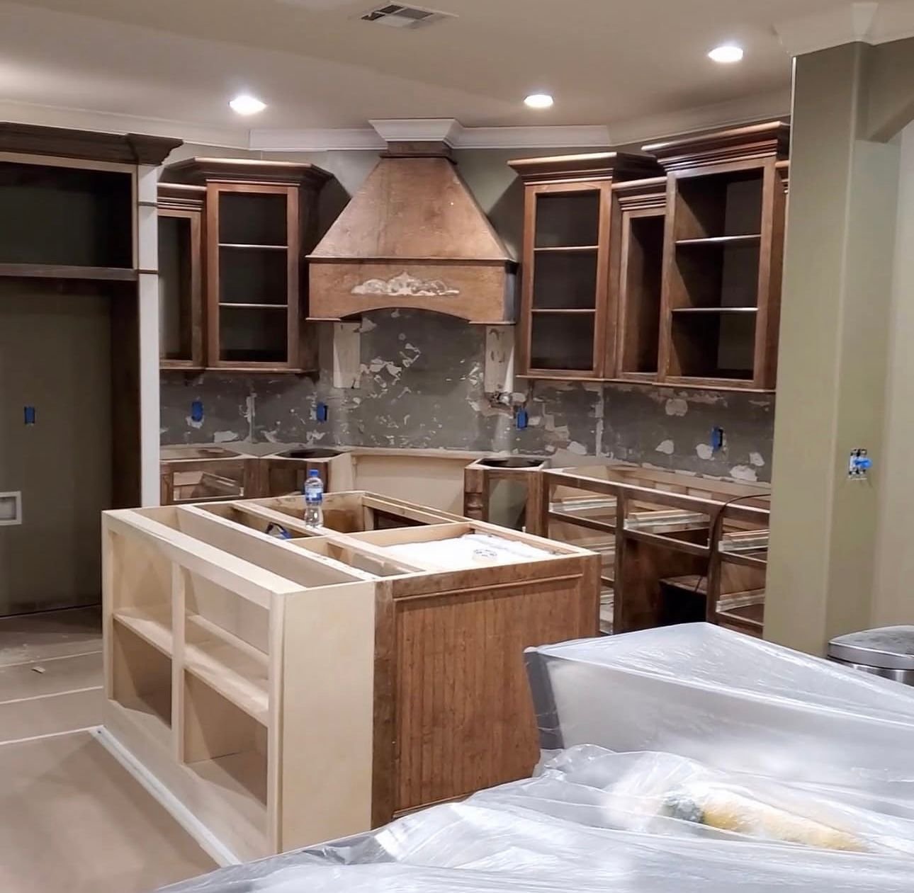 Kitchen cabinets sanded and prepped during the kitchen cabinet painting process