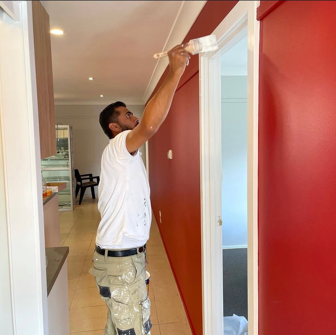 Colourland Painting interior painter cutting in a feature wall in a Wollongong home