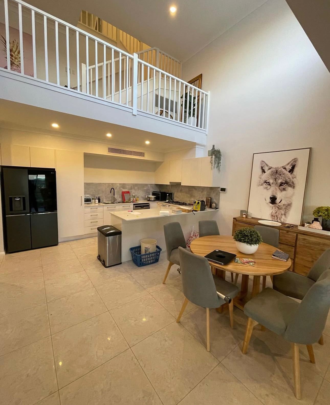 Freshly painted open-plan living and kitchen interior by Colourland Painting in Wollongong