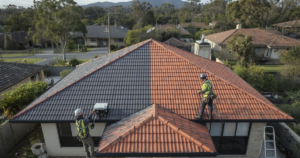 Roof painting in progress on Wollongong home in Illawarra escarpment suburb